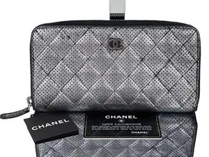 Pre-owned CHANEL Leather Clutches & Wristlets Perforated Silver Metallic Lambskin Quilted Zip Around Wallet Clutch