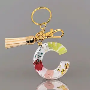 Keychains with Real Flowe Floral Design and Tassel Accent - Product Description Provided