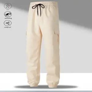 Men's work pants with an adjustable drawstring waistband, allowing for easy tightness adjustment. The pants feature multiple pockets, especially large side pockets, which are both practical and decorative, adding a rugged workwear feel. Suitable for weari