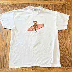 Curious Georgee Surfing Graphic T-Shirt – Black Cotton Tee, Cute Cartoon Monkey Shirt, Unisex Casual Streetwear Top, unisex shirt, gift for her for him