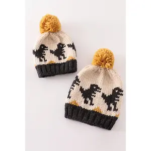 Black pompom dinosaur cable beanie