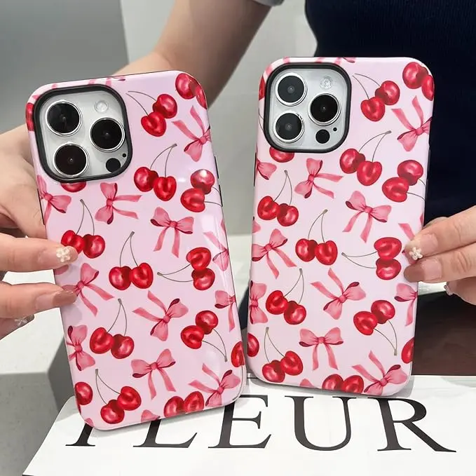 Cherry and bowknot pattern phone case, compatible with the latest iPhone 17/16/15 Pro Max, 15/16 Plus, and 13/14 models Features a double-layer TPU and PC construction for drop protection, and is designed specifically for women