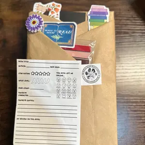 Blind Date with a Book! Comes with: 1 Book, book tabs, stickers, a bookmark, 1 croc charm and a book review sheet