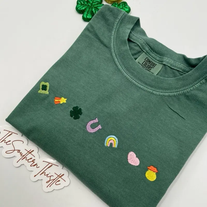 Lucky Charms Embroidered T-Shirt | St. Patrick’s Day Tee | Clover, Rainbow, and Horseshoe Appliqué Shirt | Festive Irish Lucky Charm Tee