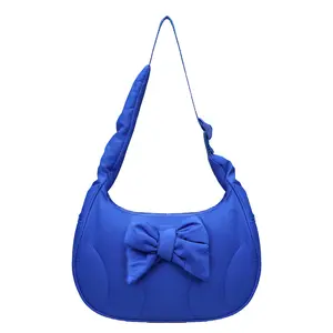 RIVERICH Quilted Puffer Shoulder Bag with Detachable Bow, Winter Coquette Aesthetic Vegan Leather Crossbody Purse, Padded Cloud-like Bag perfect for seasonal holiday outfits, date nights, or adding a feminine touch to cold-weather fashion