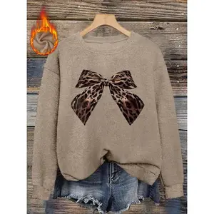 Women’s casual and fashionable crew-neck sweater top with leopard print bow print, made from comfortable knit fabric, suitable for autumn and winter, featuring a fitted style