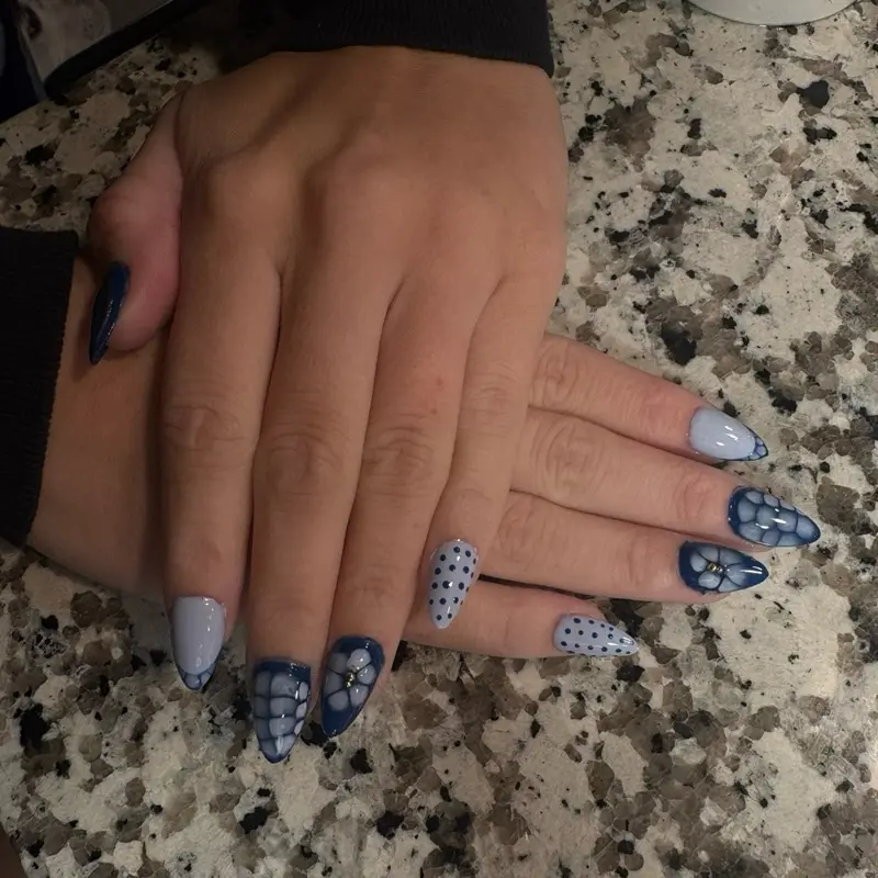 Gel x Nails - Blue and White Polka Dot Design with Floral Accents for Stylish Manicure