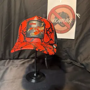 Dagger Red Snake Skin Embroidered Trucker Cap