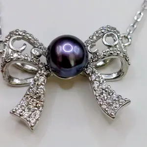 Midnight Ribbon Pearl Necklace with Elegant Bow Design and Sparkling Accents