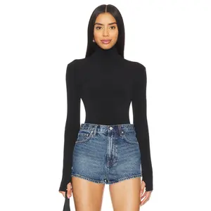 Norma Kamali Slim Fit Long Sleeve Turtleneck Top in Black