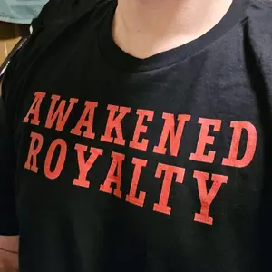 Awakened Royalty Black T-Shirt with Bold Red Lettering for Men and Women