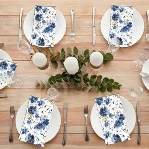 20 Pieces of Elegant Decorative Paper Napkins, featuring a blue and gold floral design, with the gold flower pattern prominently displayed. Perfect for picnics, outdoor celebrations, rural weddings, spring tea parties, and birthday parties for decoration.