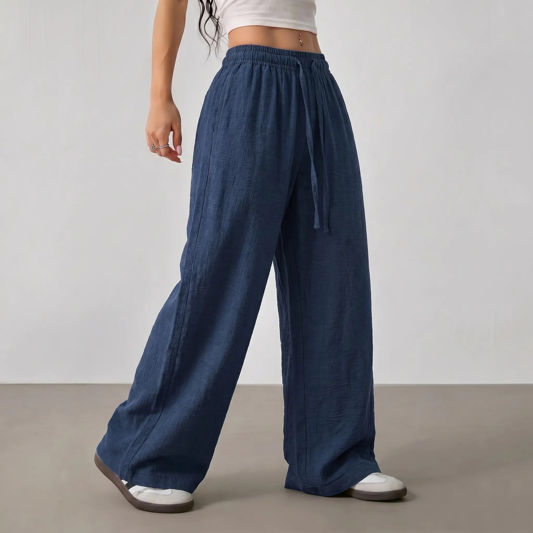 Women’s lightweight minimalist solid-color casual pants, 100% polyester fabric, loose and breathable long trousers, suitable for vacations and everyday wear.