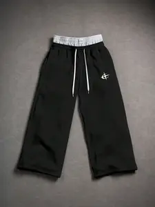 One piece men’s wide-leg casual sweatpants featuring a color-block waist and geometric print; urban relaxed style. Double-layer color-block drawstring waistband paired with geometric prints on the pants body. Soft knit fabric drapes comfortably, and the l