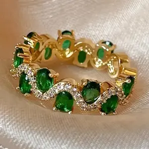 Simulated Emerald CZ Gold Tone Adjustable Ring with Green Gemstones and Diamond Accents