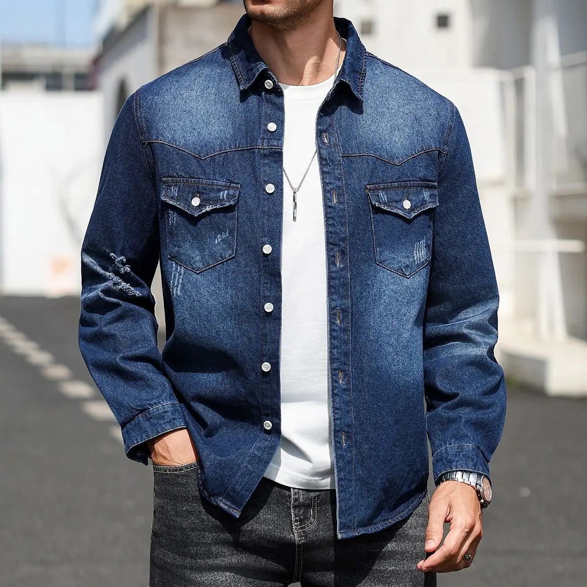 One men’s deep blue denim long sleeve shirt with distressed details, washed finish, urban casual style, notched lapel button design paired with two pockets; the denim fabric drapes well and has a structured feel—ideal for city men’s everyday commuting, ca
