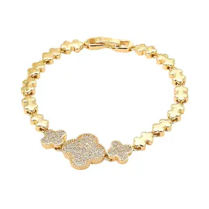 Triple CZ Stone Paved Quatrefoil Link Beaded Bracelet in Brass with Fold Over Closure for Stylish Everyday Wear