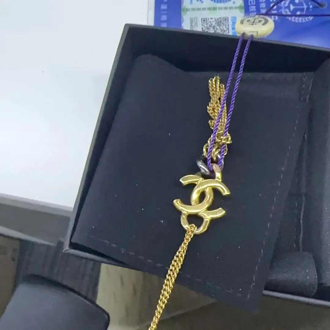 Pre-owned CHANEL Double C Gunmetal Ring Tassel Pendant Necklace – Gold Tone Metal, 95% Condition JLP012146