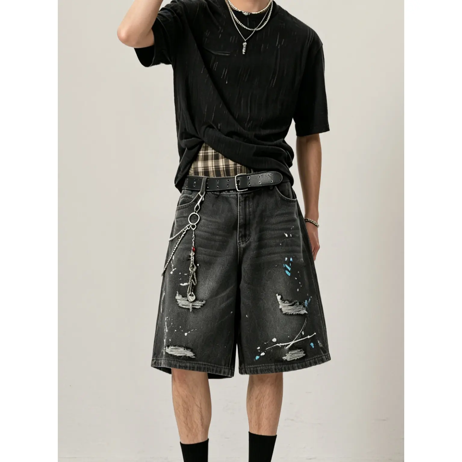 Stylish Black Denim Shorts with Unique Paint Splatter Design and Chain Detail for Men