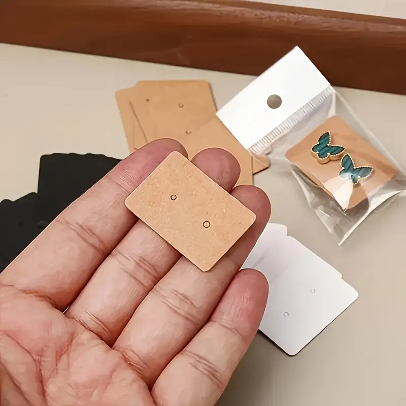 Jewelry Display Cards and Self sealing OPP Bag Cover 400pcs - A paper earring display stand suitable for small business packaging, with 200 independent earring cards and 200 transparent bags, lightweight, jewelry making display and packaging supplies