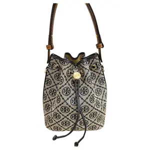 Tory Burch Monogram Canvas and Leather Trim Drawstring Bucket Bag for Women in Navy Blue