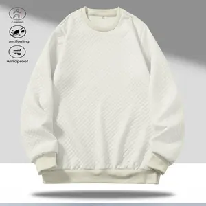 A beige crewneck sweater with a grid pattern, featuring a stylish casual design. The crewneck enhances the look, while the grid pattern fabric offers a delicate texture that provides structure without sagging. Finished with neat ribbed cuffs and a hem.