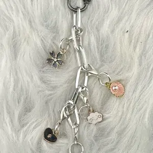 Floral Kindle Charm Accessory with Silver paperclip chain links attached to black rectangular Loop