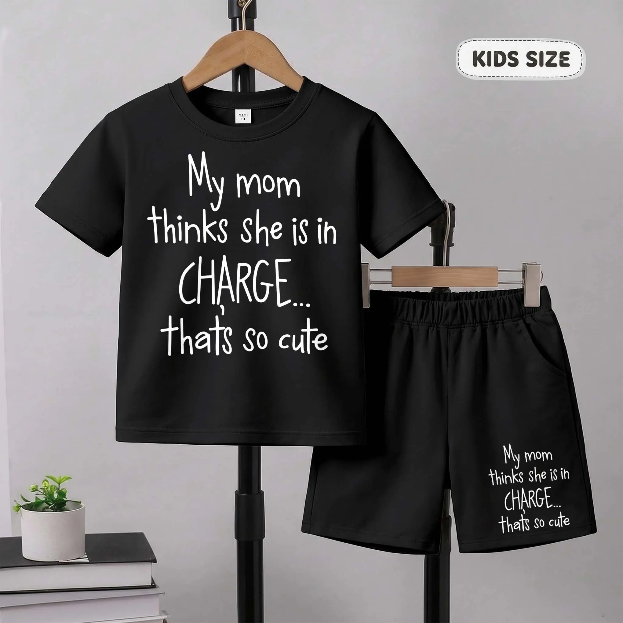 Children's My Mom Thinks She Is In Charge ... That‘s So Cute Print Short-Sleeve T-Shirt And Shorts Set—Casual Summer Kids' Clothing. This Round-Neck Outfit Combination Is Perfect For Everyday Wear And Outdoor Play.