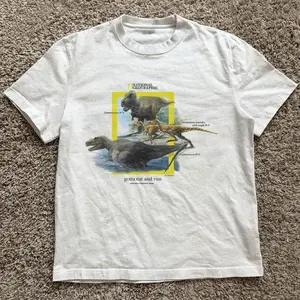 Gildan Men's and Women's T-shirt, 1990s National Geographic dinosaurs “gotta eat and run” tee, Animal tee, Y2k Unisex Graphic Tees Gothic Grunge Emo Scene Amity Affliction Style Clothes Menswear Womenswear Streetwear
