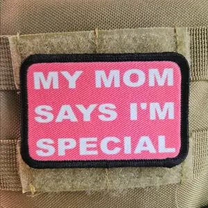 pink my mom says i'm special funny 2"x3" morale patch with hook and loop backing background