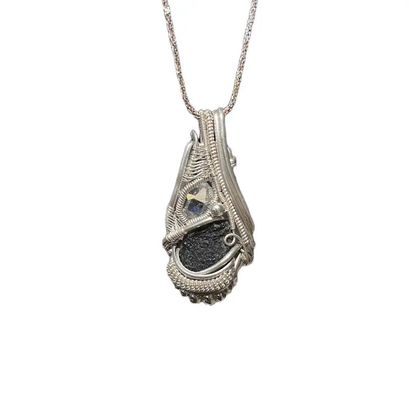 Moldavite and a Herkimer diamond wrapped in sterling silver wire comes with sterling silver chain. This is a handmade wire wrapped pendant.