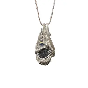 Moldavite and a Herkimer diamond wrapped in sterling silver wire comes with sterling silver chain. This is a handmade wire wrapped pendant.