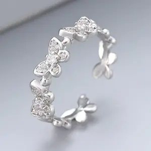 Minimalist and versatile brass butterfly ring with stones and inlays, perfect for women to wear everyday