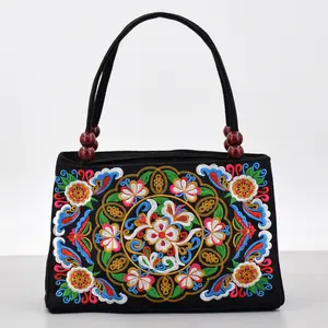 Ethnic-style double-sided embroidered tote bag with wooden beads; double-zip canvas tote with portable phone and wallet compartment