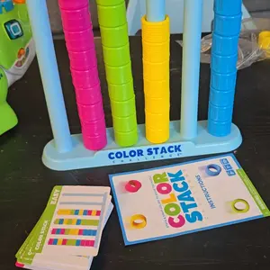 Color Stack Challenge by Relatable – A Fast-Paced Color Matching Puzzle Game for Fun Parties and Family Game Night. Includes 2 Stack Racks, 50 Challenge Cards, 80 Rings & Instructions