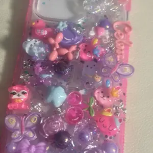 Junk Case with Colorful Decorative Elements and Glittery Accents for a Fun and Unique Look