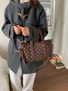 Retro Storm Dot Printed Commuter Handbag | With a crossbody strap and polka dot print, it can hold a phone, lipstick, and other small items, making it versatile and suitable for daily commuting and dating