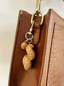 A fashionable and versatile imitation peanut keychain, a light luxury imitation peanut granule bag portable pendant, suitable for keybags, backpacks, pendants, and accessories, Cute Charms Keychain
