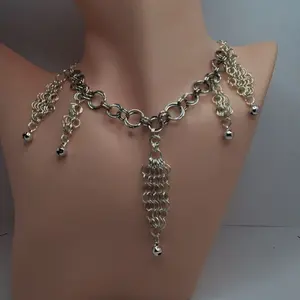 Stainless Steel "Smiling Jester" Necklace with Chain Design and Bell Accents