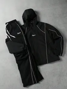 Men’s casual set featuring color-block line embroidery and a hood; urban relaxed style with pure black as the primary color—stable and versatile. The top has a drawstring hood design paired with color-block lines and embroidered details at the chest, whil