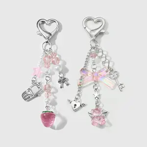 Set of 2 sweet girl keychains/key rings: versatile fashion items with attractive designs featuring beaded bows, strawberry crystal bears, and bag hangers. Suitable for sisters and best friends’ everyday wear; great as holiday gifts.