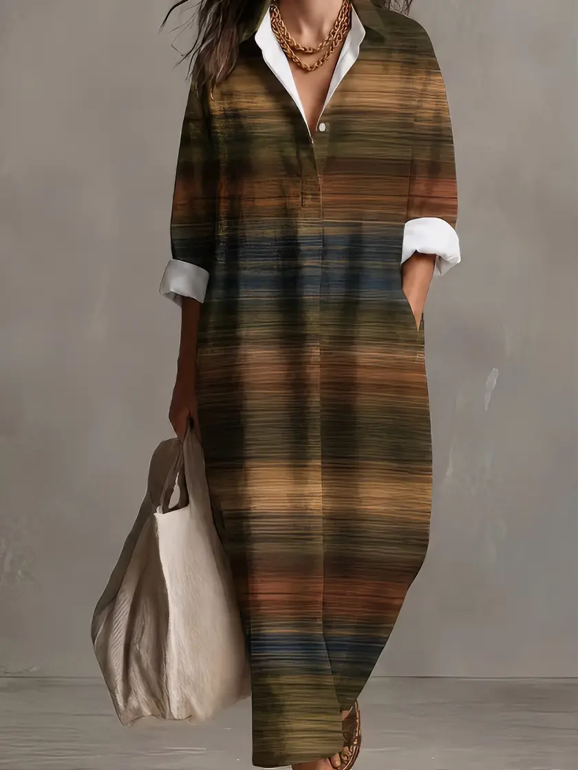 Plus-size women's earth-tone plaid button-up shirt dress, with a lapel, long sleeves, and a loose, long-length design. A casual autumn-season cover-up shirt dress.