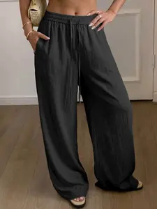 Women’s ultra-comfortable casual pants made from Lyocell linen weave, featuring pockets, a drawstring elastic waistband, soft fabric, and drapey legs—an essential for summer.