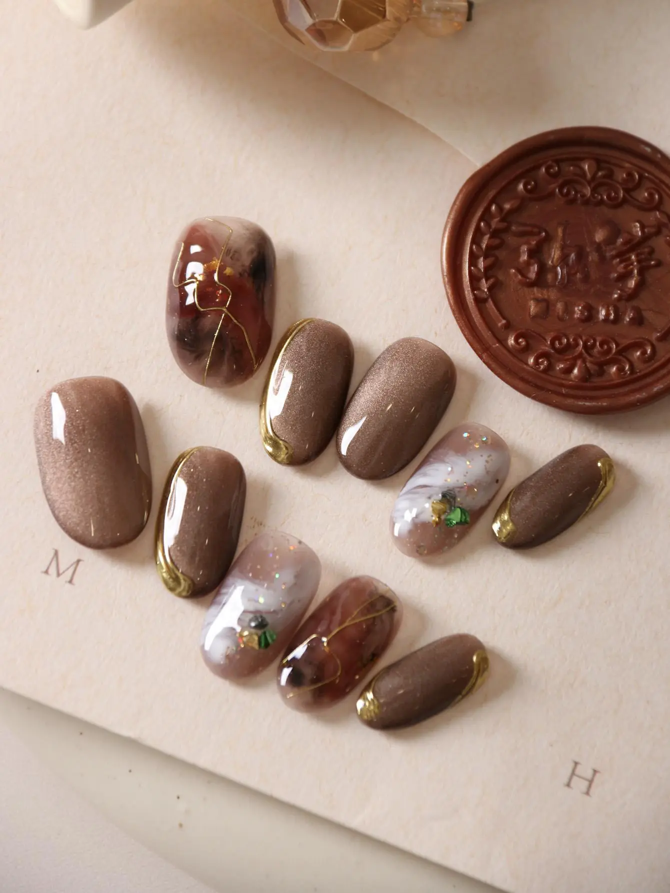 10Pcs Press on Nails Short Brown Nails Halation Acrylic Press on Nails Fake Nails Includes 1 Sheet Adhesive Tabs & 1 Pc Mini File