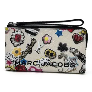 Marc Jacobs Sticker Print Bold SLG Wristlet Playful Designer Carry All Compact Lightweight with Detachable Strap for Travel and Daily Use