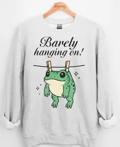 Barely Hanging On Graphic Top Barely Hanging On Graphic Top