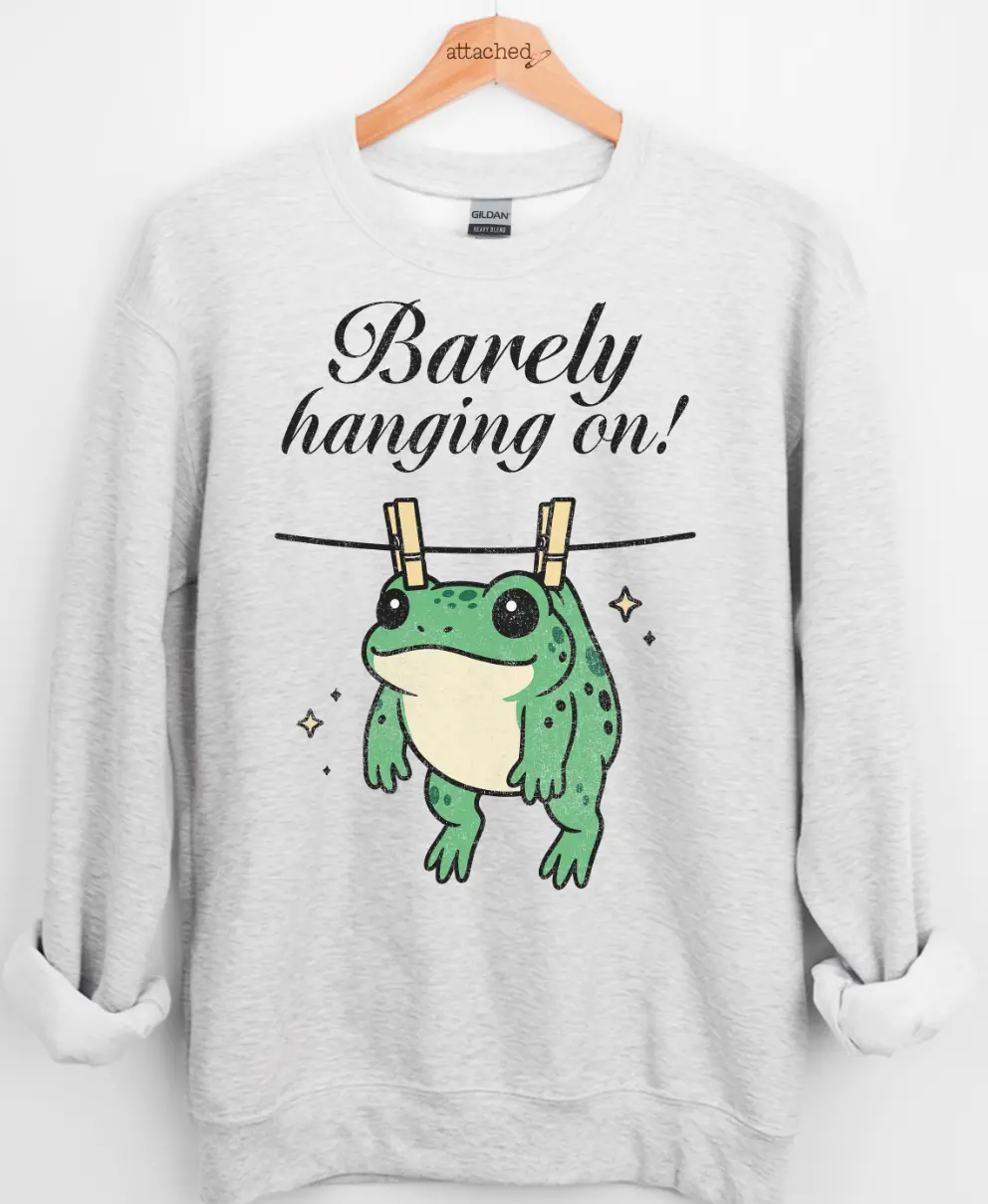 Barely Hanging On Graphic Top Barely Hanging On Graphic Top