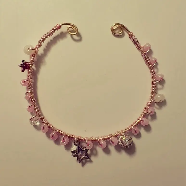 Handcrafted Adjustable Wire Bracelet with Pink Beads and Star Charms for Any Occasion