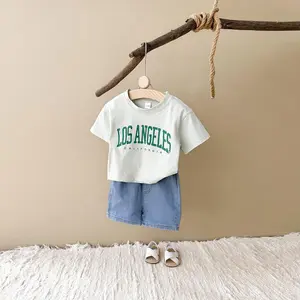 Two-piece summer versatile baby clothing alphabet patch light green short sleeves + loose denim shorts baby sports suit