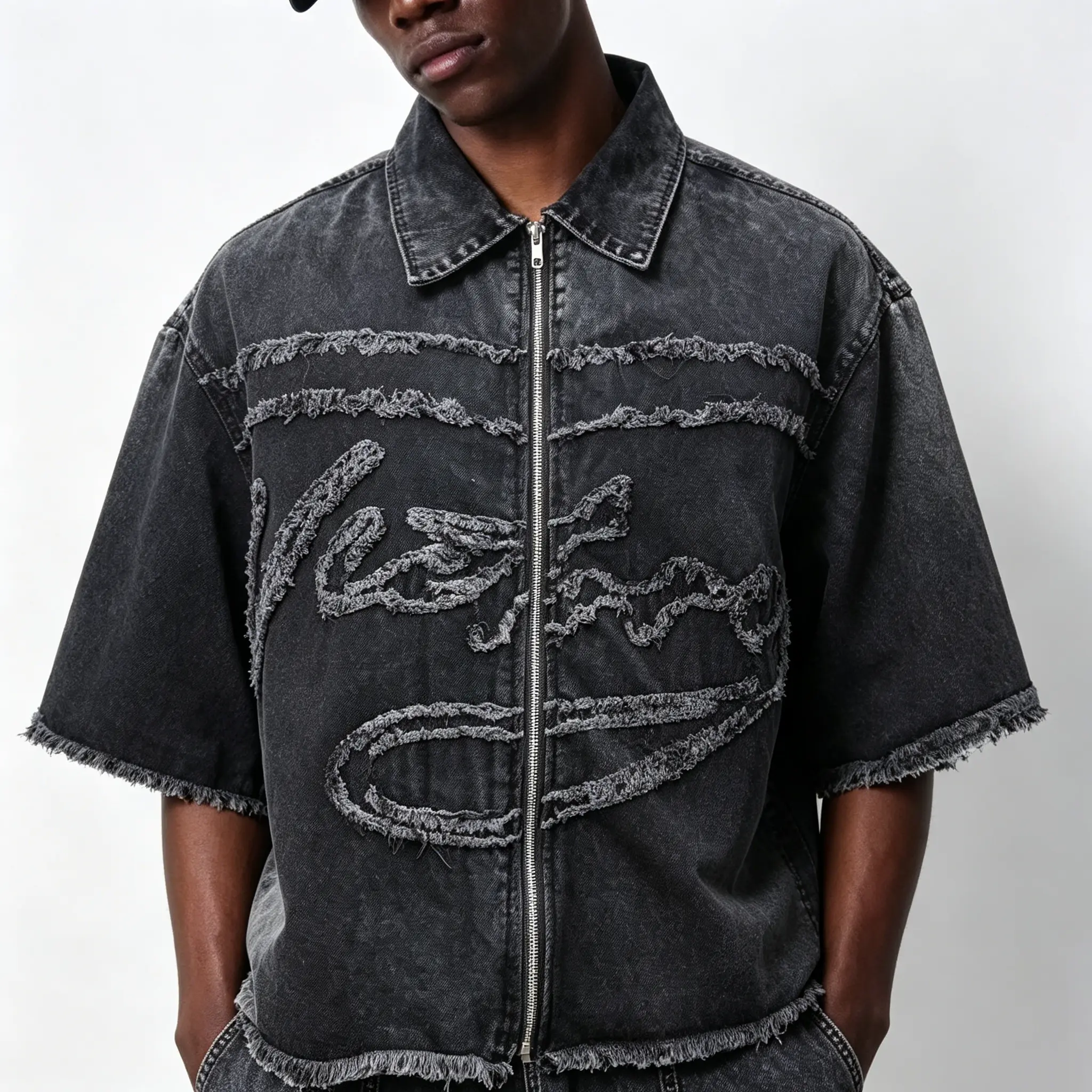 Grunge distressed zip-up denim shacket with short sleeves, lapel collar, large fringe, letter patchwork, frayed raw edge, oversized baggy fit—urban skater apparel, unisex youth street casual outer layer garment
